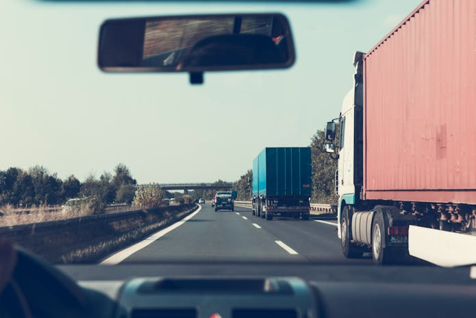 A truck driving down the highway, representing a Dallas Truck Accident Injury Attorney's perspective.