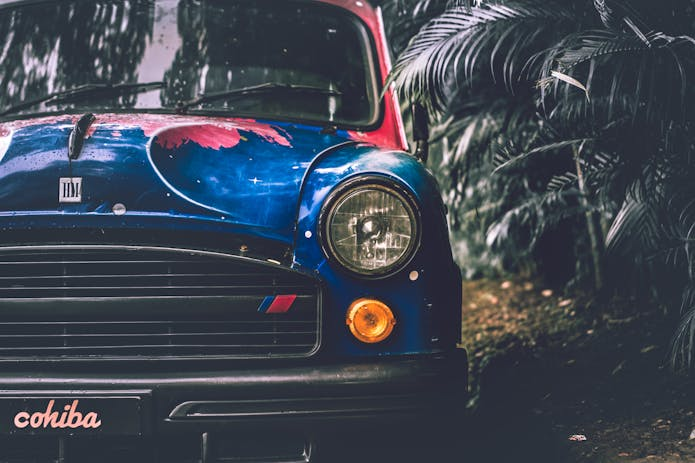  Image of a blue car adorned with red and white design, hinting at a potential legal case requiring Glendale auto accident lawyer.