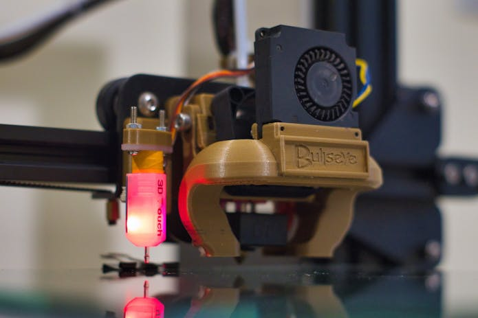 Revolutionary 3D printer with red light, holds title of world's largest.