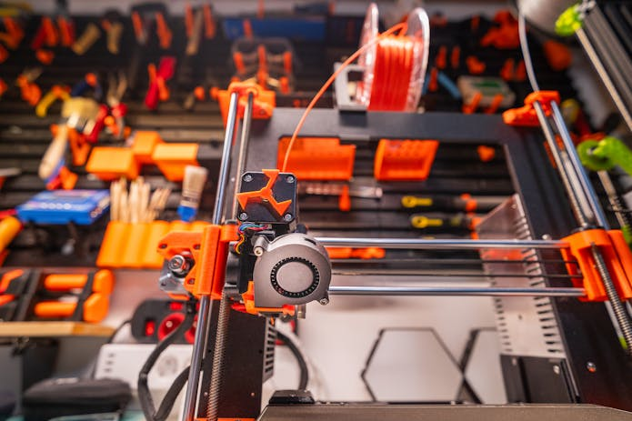 Step into a workshop and marvel at the World's Largest 3D Printer surrounded by various tools.