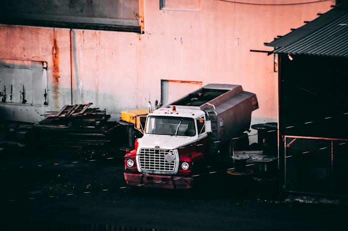 Receive legal advice from a truck accident injury attorney near me for a truck parked in front of a building.