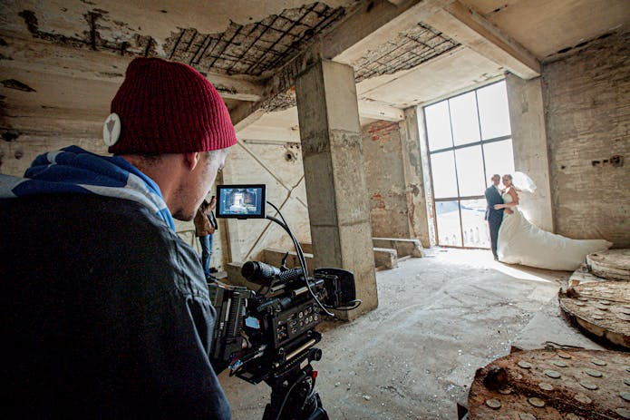 A man capturing a wedding in a historic venue, part of the Bridgerton Filming Locations.