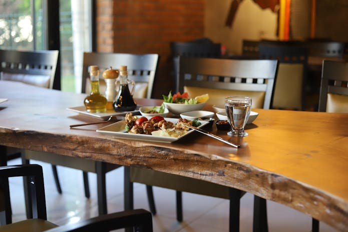 A spread of delectable cuisine and beverages arranged on a table at Olive Garden Uva Restaurant.