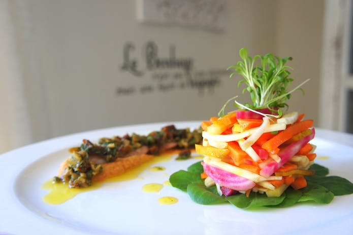 Fresh salad and vegetables on a plate at chilis Restaurants in New York.