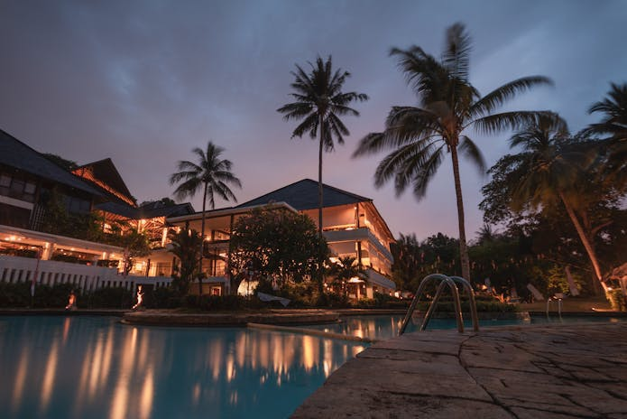 Nighttime pool at beach resort, perfect for Winter Spa Retreats.