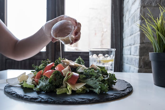  Salad being dressed at Khe-Yo chilis Restaurants in New York.